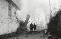 Infantrymen advance under fire, Pont-Le-Ban, Belgium, January 1945